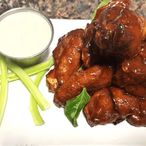Sauced chicken wings with celery and ranch